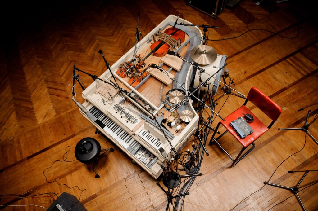 See Band Transform Broken Grand Piano Into 20-Piece Instrument