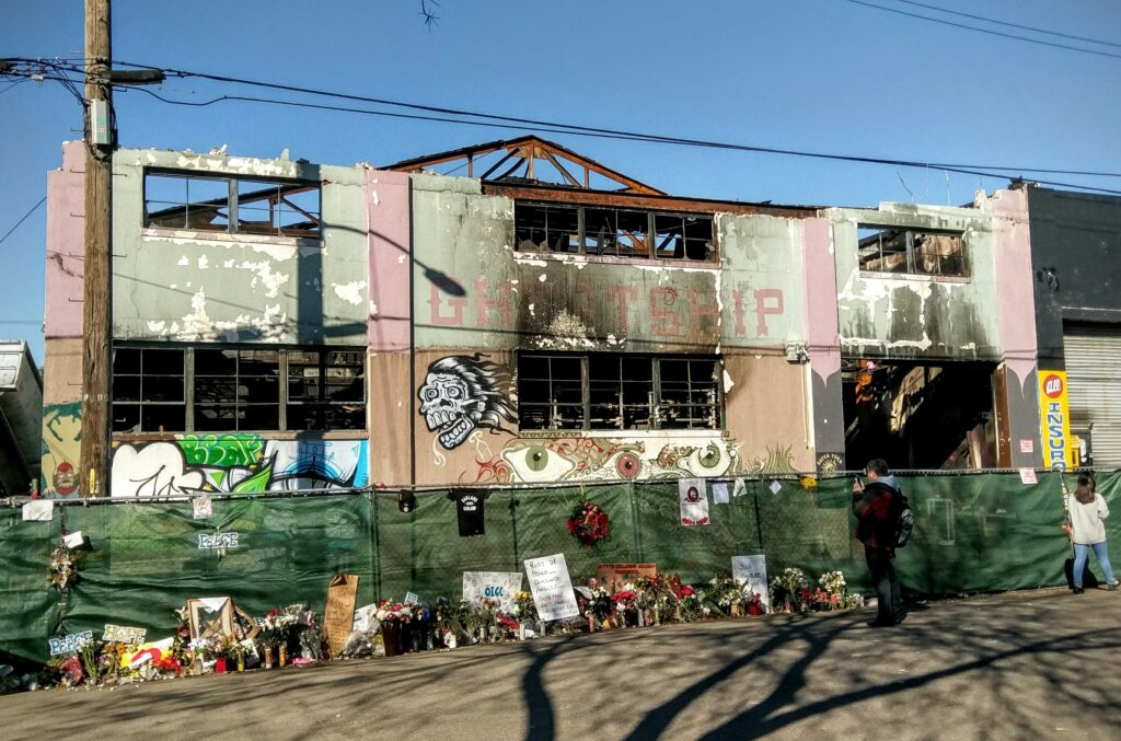 Oakland Reaches $32.7 Million Settlement With 32 Ghost Ship Fire Victims & Families